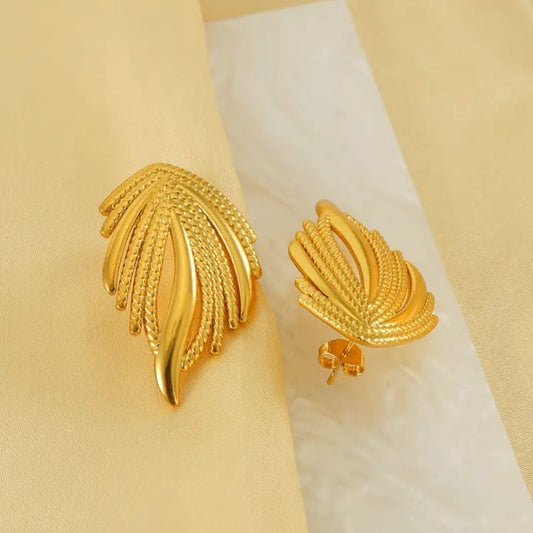 Golden palm frond studs - Luxe elegance redefined
