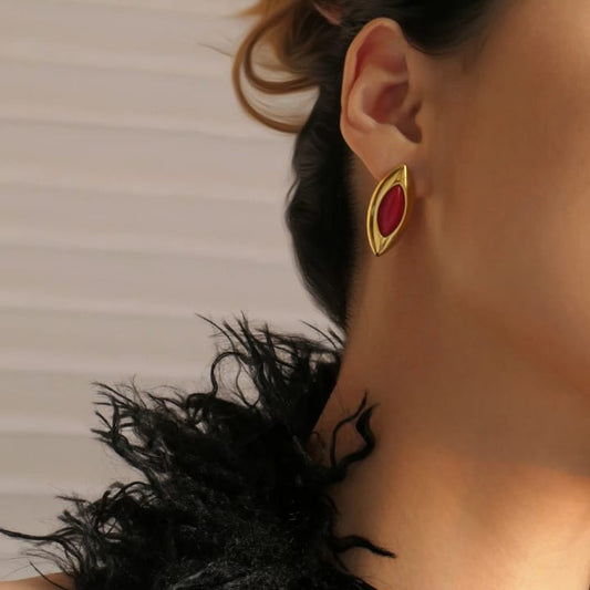 'Crimson Marquise: Gold Framed Elegance'