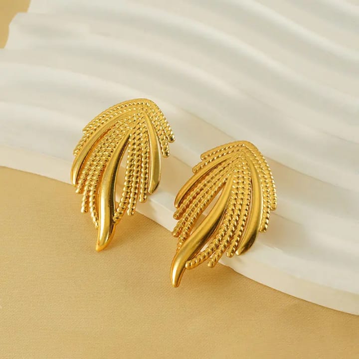 Golden palm frond studs - Luxe elegance redefined